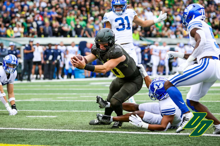 Oregon Ducks quarterback Bo Nix extends for a touchdown against the BYU Cougars at Autzen Stadium in Eugene, Oregon.